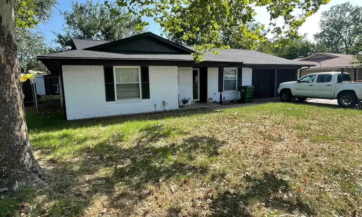 Professional roofing crew working on a residential roof in Gainesville